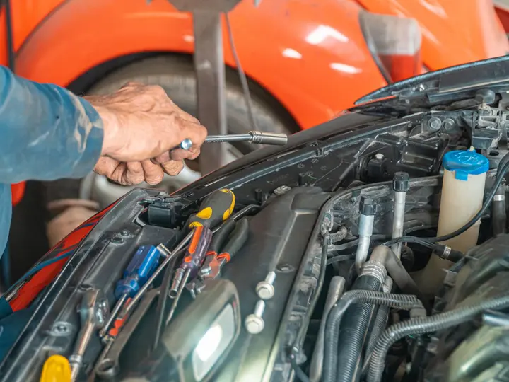 Mechanic working on a vehicle engine
