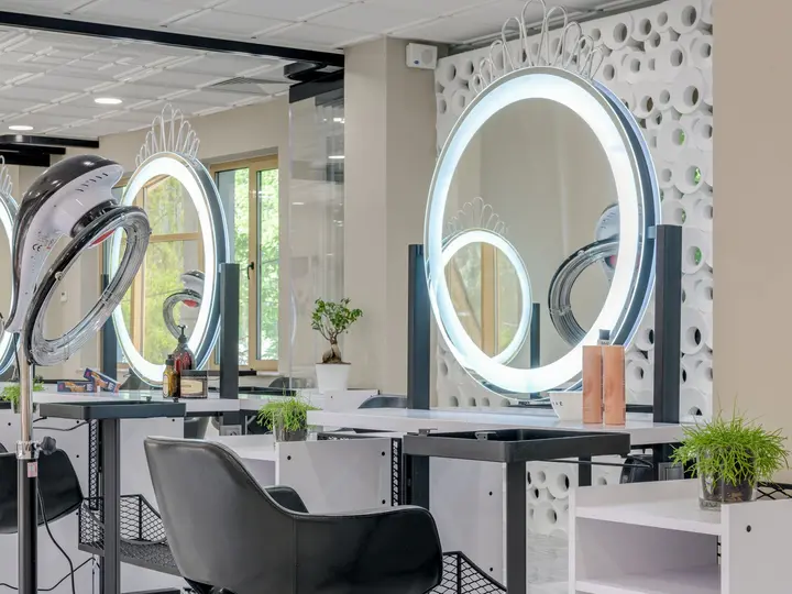 Elegant salon interior with illuminated mirrors